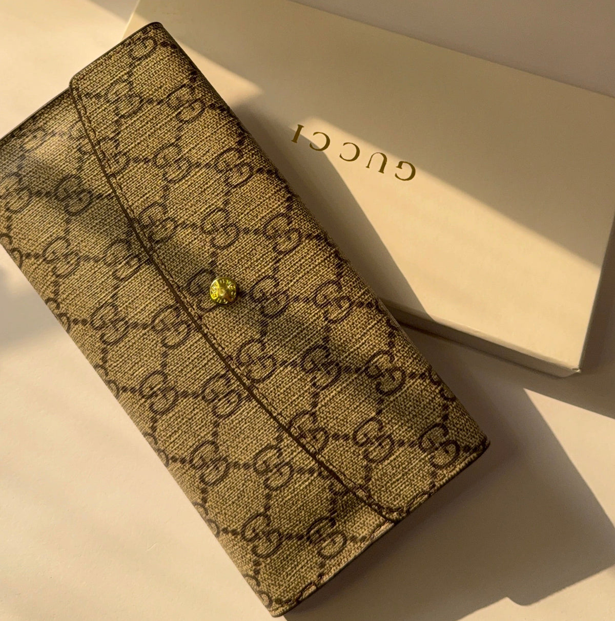 Gucci GG Supreme Continental Wallet with gold bee stud closure